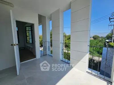 Spacious balcony with scenic view and elegant railing design