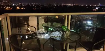 Stunning balcony view with city lights, perfect for evening relaxation.