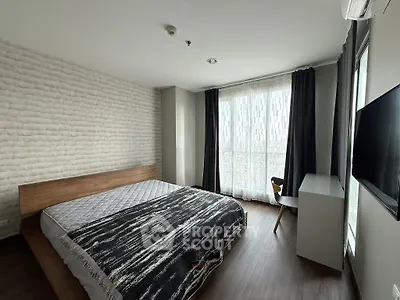 Modern bedroom with large window and stylish decor