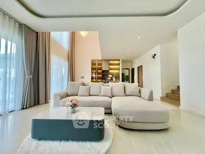 Spacious modern living room with elegant furniture and high ceilings