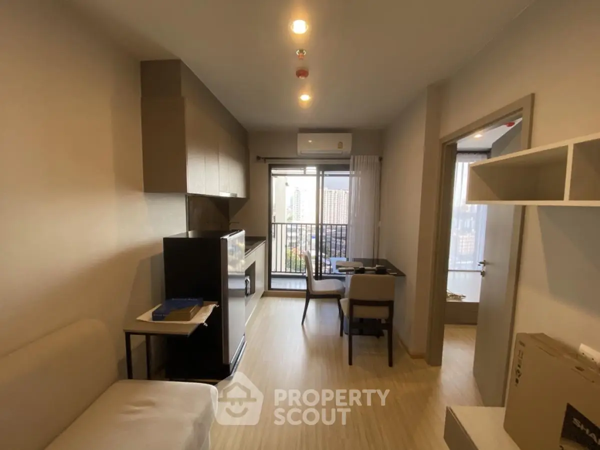 Modern apartment interior with open layout and city view balcony