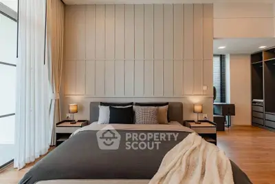 Luxurious modern bedroom with elegant decor and ample natural light