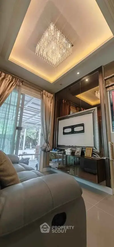 Luxurious living room with elegant chandelier and modern decor