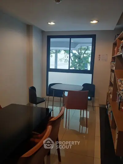 Cozy study area with modern furniture and large window view