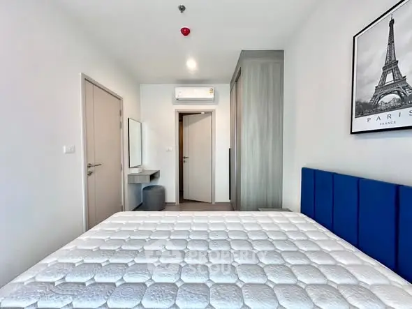 Modern bedroom with stylish decor and comfortable bed in a contemporary apartment.