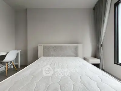 Modern minimalist bedroom with large window and stylish furniture