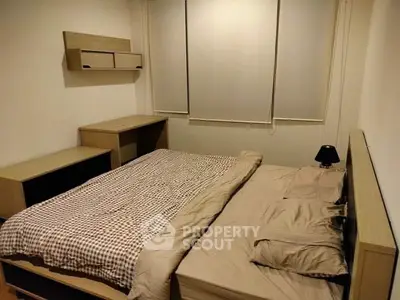 Cozy bedroom with modern furniture and neutral tones, perfect for relaxation and comfort.