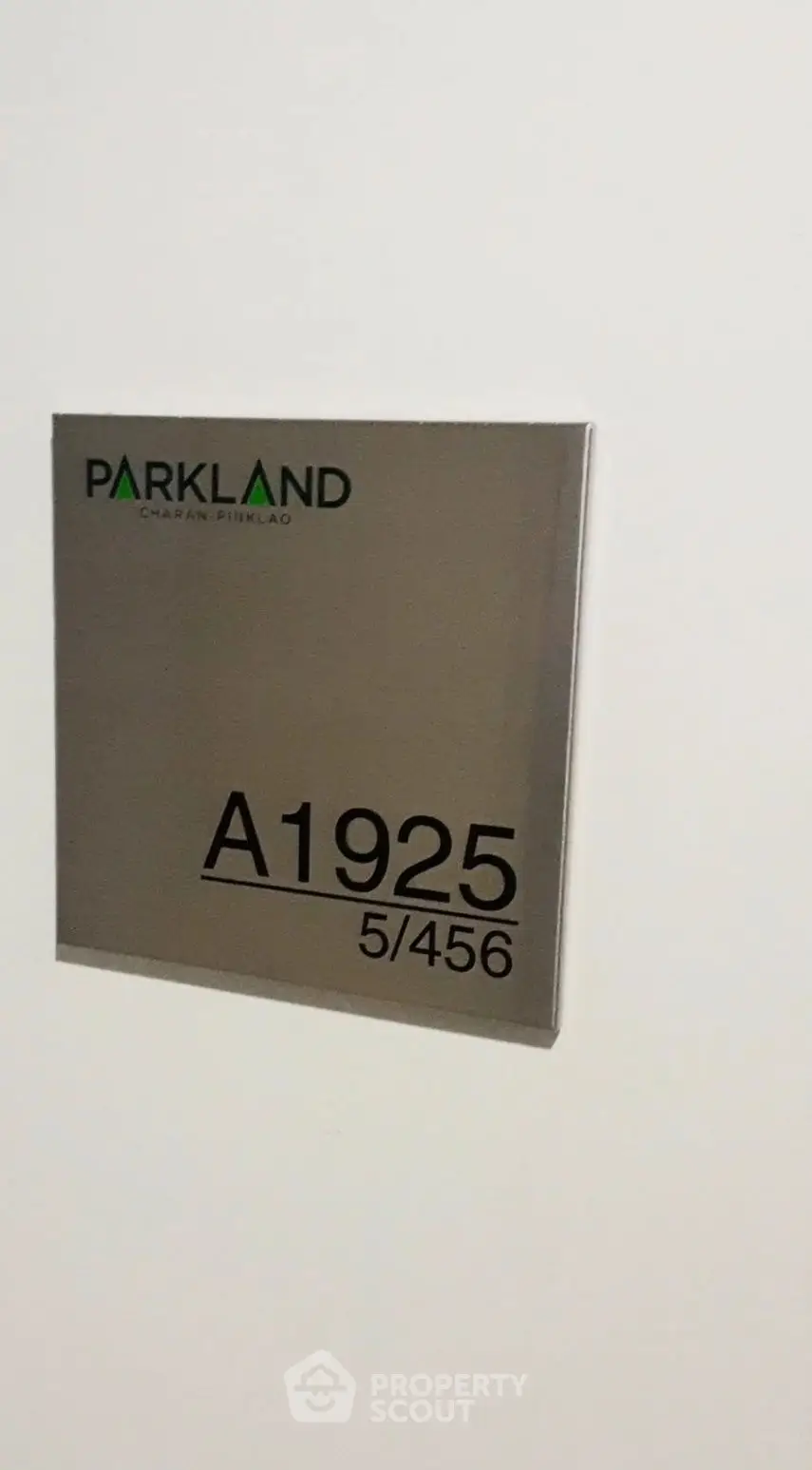 Modern apartment unit sign at Parkland with unit number A1925 5/456.