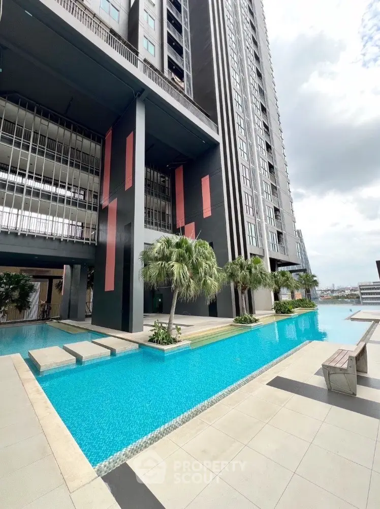 Luxurious high-rise building with stunning pool and modern architecture