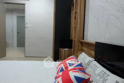 Modern bedroom with stylish decor and Union Jack pillows