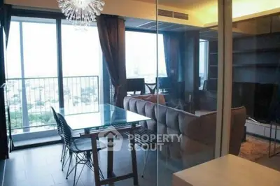 Modern living room with glass wall and city view balcony