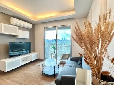 Modern living room with city view, sleek furniture, and ambient lighting.