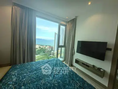Luxurious bedroom with stunning city view and modern TV setup