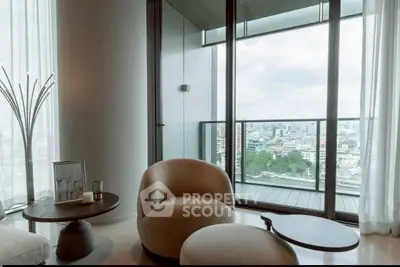 Luxurious living room with stunning city view from large balcony, modern furniture and elegant decor.