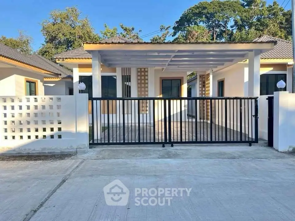 Charming single-story home with modern design and spacious driveway in a serene neighborhood.