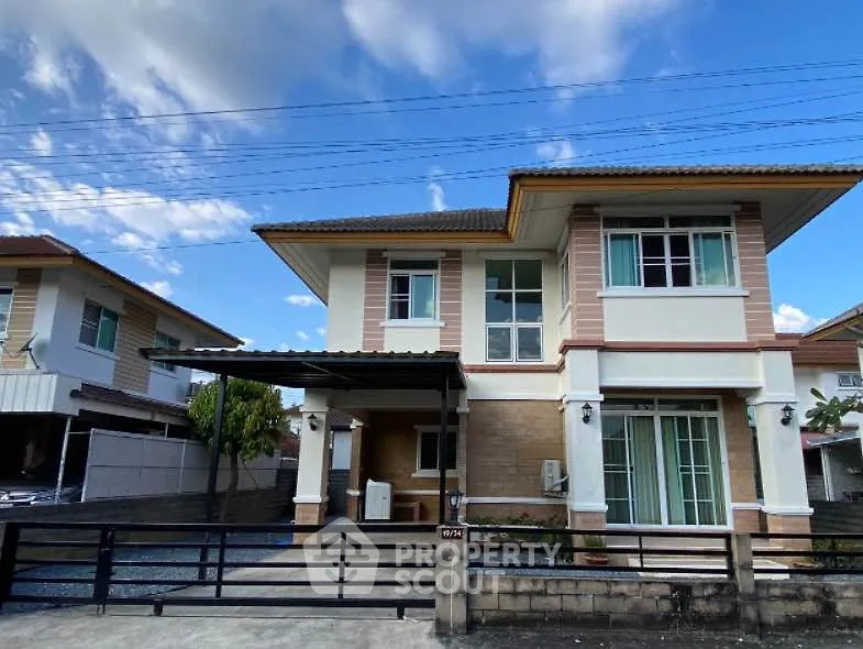 Charming two-story house with modern design and spacious driveway in suburban neighborhood.