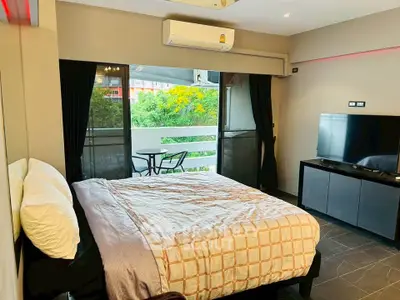 Modern bedroom with balcony view and stylish decor