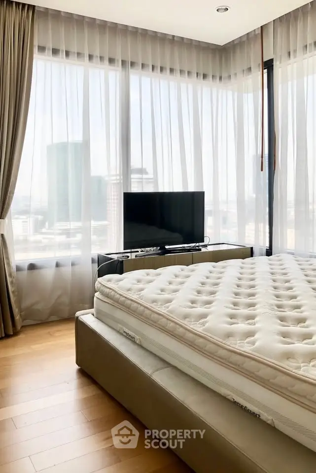 Luxurious bedroom with panoramic city view and modern decor