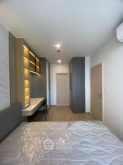 Modern bedroom with stylish built-in shelves and cozy lighting