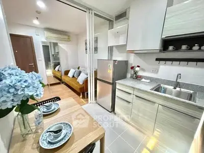 Modern open-layout kitchen with dining area and cozy living room