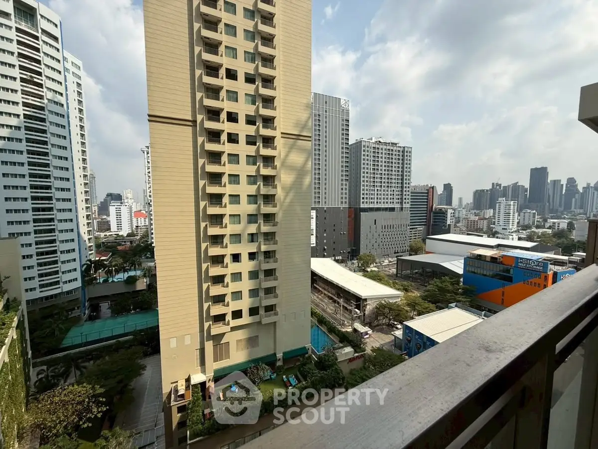 Stunning cityscape view from a high-rise balcony in a modern urban setting.