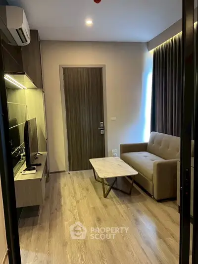 Modern living room with sleek furniture and stylish decor, perfect for urban living.