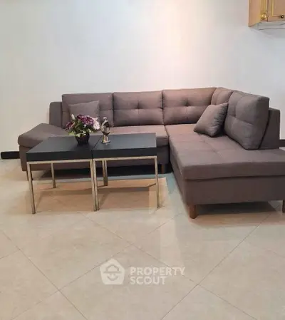Spacious living room with modern sectional sofa and coffee table