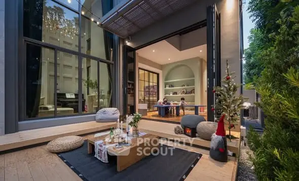 Modern home with open living area and cozy outdoor deck, perfect for entertaining.