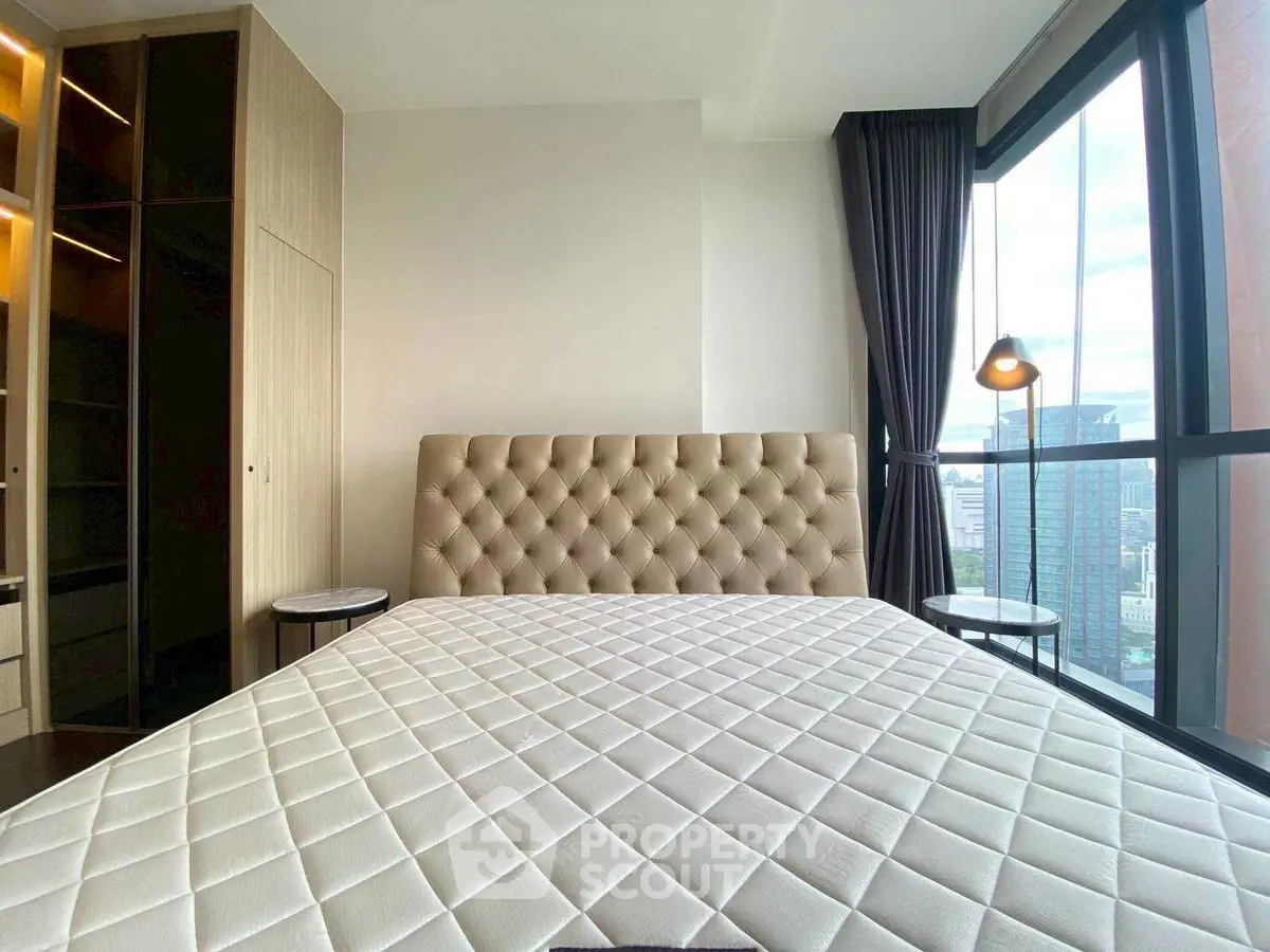 Luxurious bedroom with city view and elegant furnishings