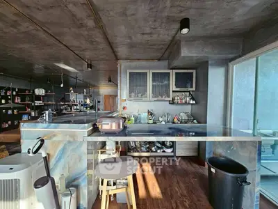 Modern kitchen with sleek marble countertops and open layout design