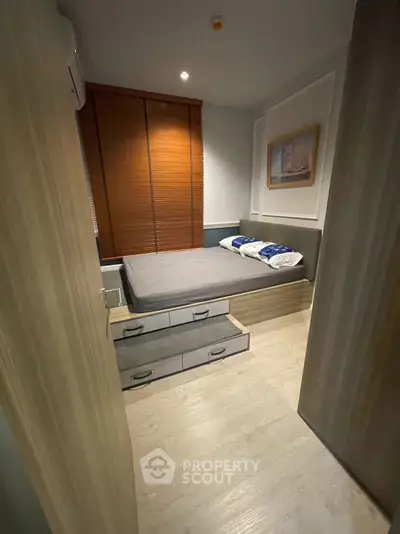 Cozy modern bedroom with built-in storage and stylish decor