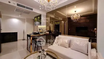 Luxurious modern living room with elegant chandelier and open kitchen layout