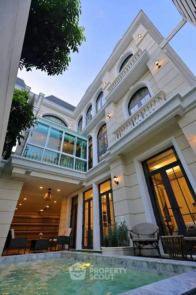 Luxurious multi-story villa with elegant architecture and private pool, perfect for upscale living.