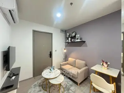 Modern cozy living room with stylish decor and neutral tones, perfect for relaxation and entertaining.