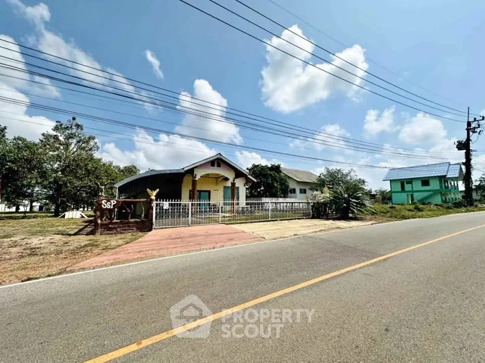 Charming countryside home with spacious yard and clear blue sky view.