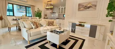 Luxurious modern living room with elegant decor and open kitchen layout