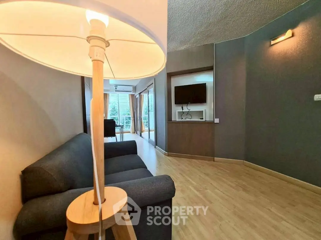 Spacious living room with modern decor and natural light