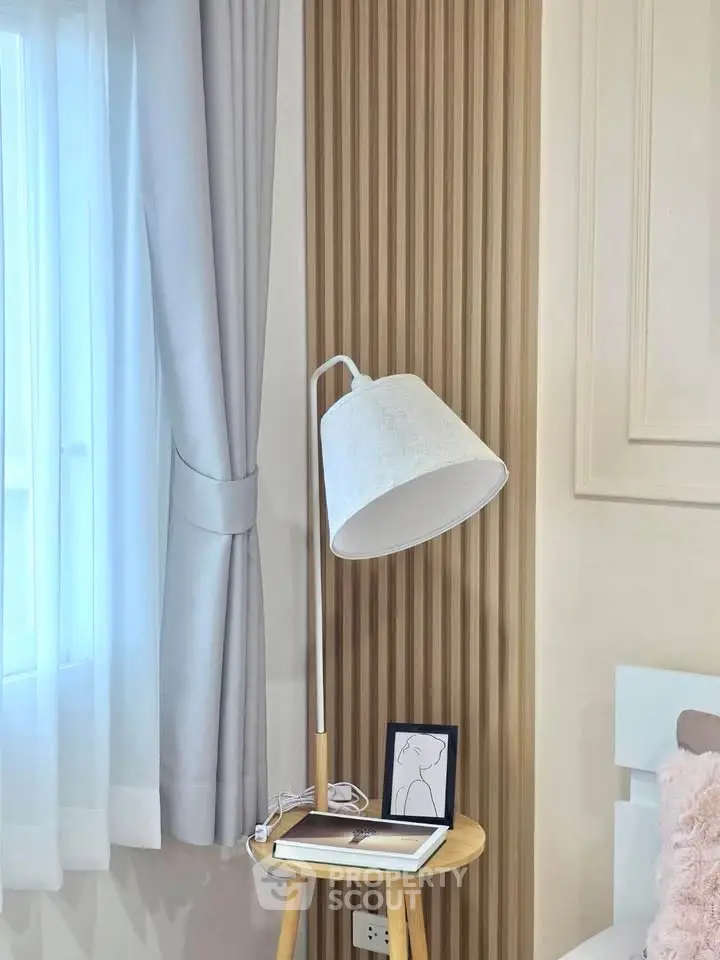 Stylish bedroom corner with modern lamp and elegant decor