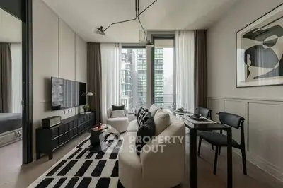 Modern living room with stylish decor and city view, featuring sleek furniture and contemporary art.