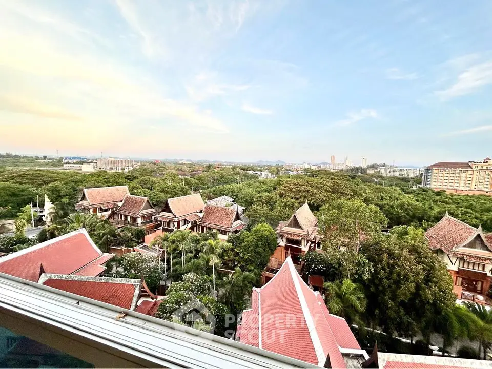 Scenic view of traditional-style villas surrounded by lush greenery and expansive skyline.