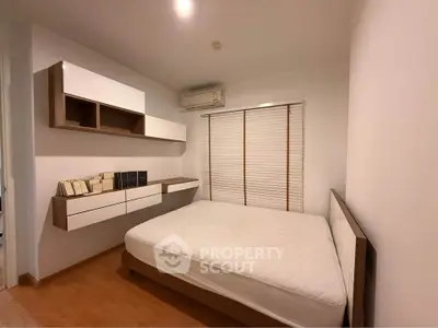 Modern bedroom with minimalist design and built-in storage solutions