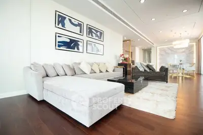 Luxurious modern living room with elegant decor and spacious seating area.