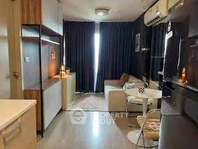 Modern living room with stylish decor and cozy seating area, perfect for relaxation.