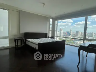 Luxurious bedroom with stunning city view and elegant furnishings