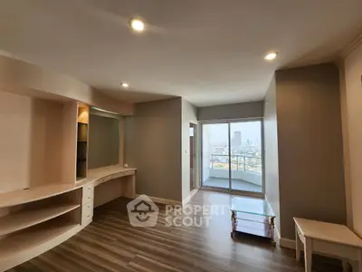 Spacious living room with city view and modern wooden flooring