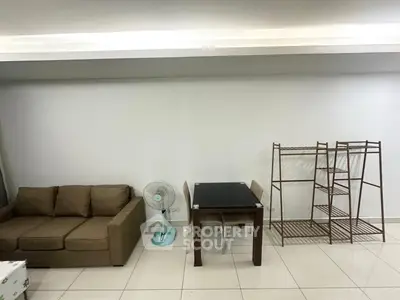 Spacious living room with modern furniture and sleek tile flooring