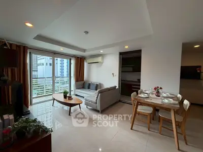 Spacious living room with balcony in modern apartment
