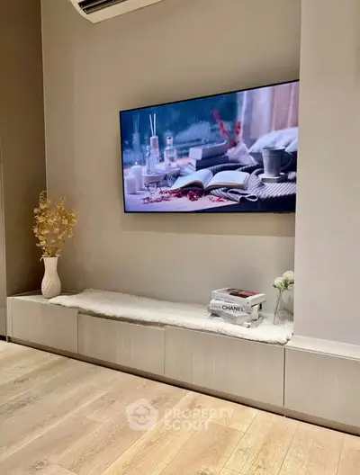 Modern living room with wall-mounted TV and stylish decor