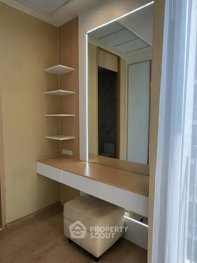 Modern bedroom corner with stylish vanity and shelving