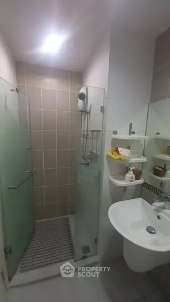 Modern bathroom with glass shower and sleek fixtures